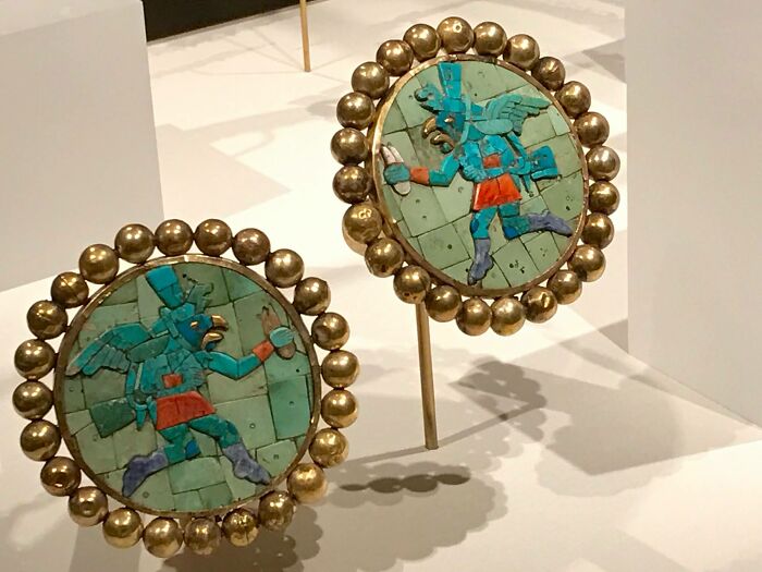 Pair Of Ear Ornaments With Winged Runners
