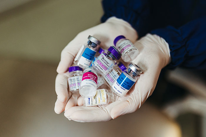Botox flasks on doctor hands