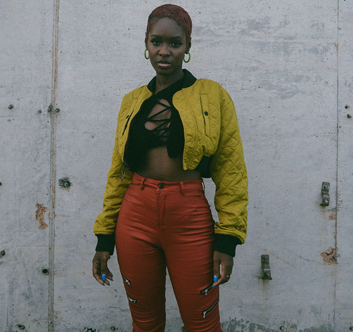 African American Fashion Model Wearing Yellow Short Jacket and Red Pants