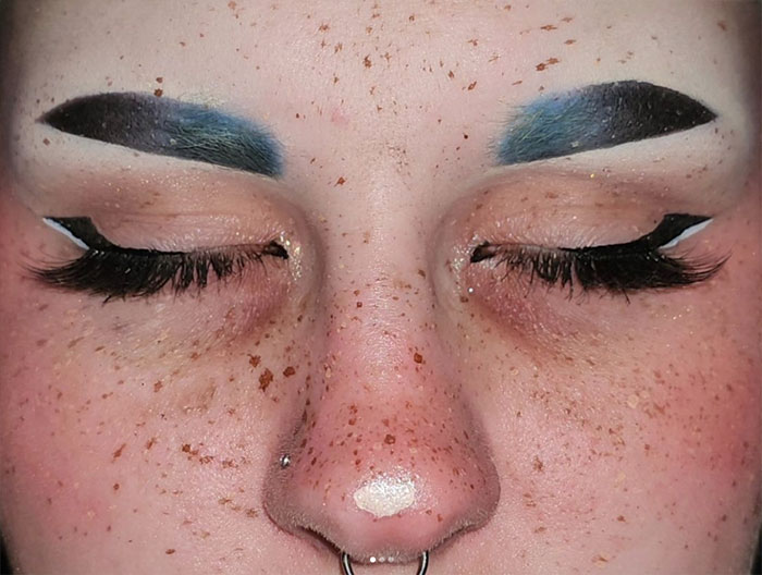 Photo of women eyes with fake freckles
