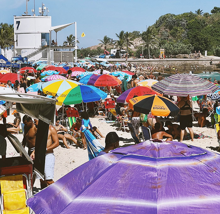 Crowded beach with many umbrellas
