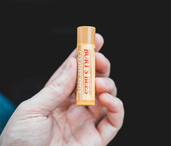 Person holding chapstick