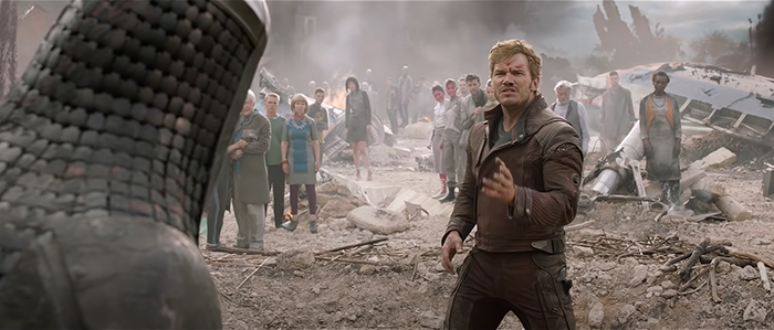 Ronan and Peter Quill from Guardians Of The Galaxy communicating and there are many people in the background