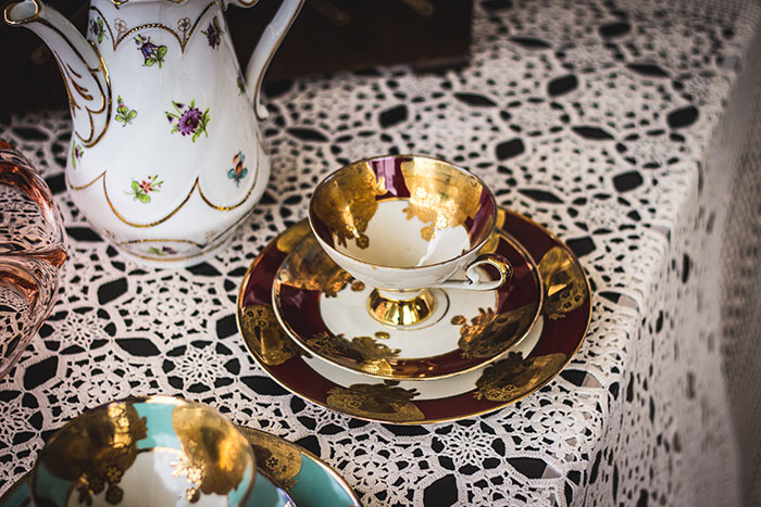 Gold and white tea cup on saucer