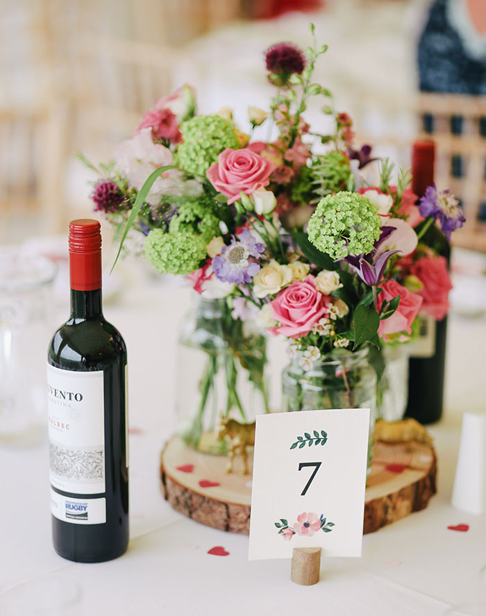 Picture of Wine bottle and flowers on the table