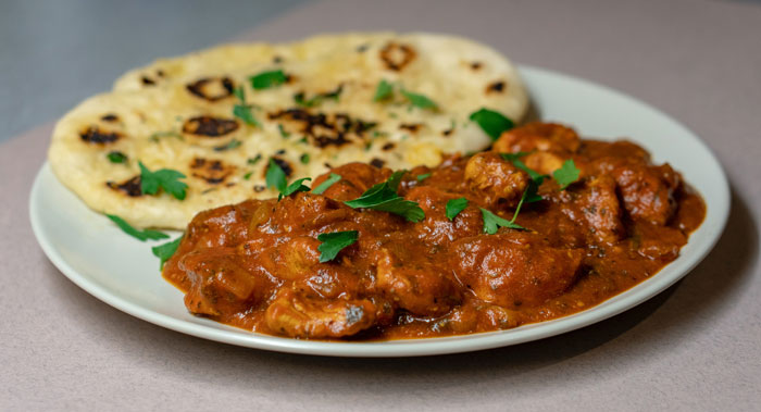 chicken tikka masala curry dish on the white plate 