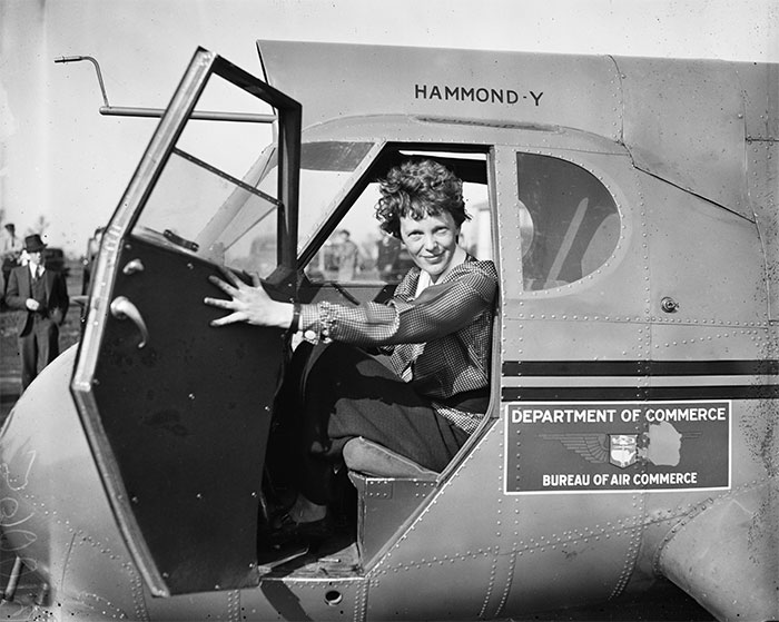 black and white Amelia Earhart in the plane portrait