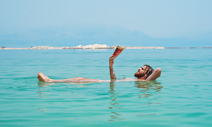Person lying in the Dead sea