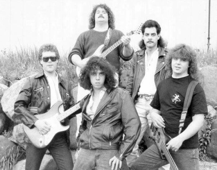 Fun Fact - The Band Member On The Top-Right Of The Photo Doesn't Actually Play An Instrument.....he Just Rocks The Mullet