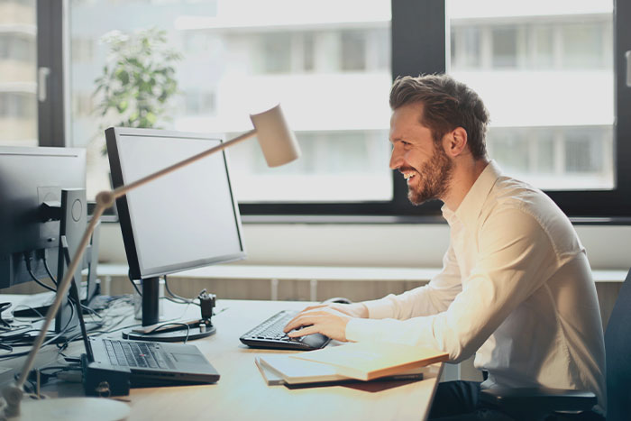 A man in front of computers 