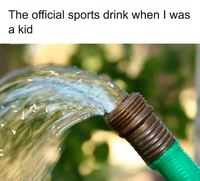 Green garden hose spraying water, humorously referred to as an "official sports drink" by older generations.