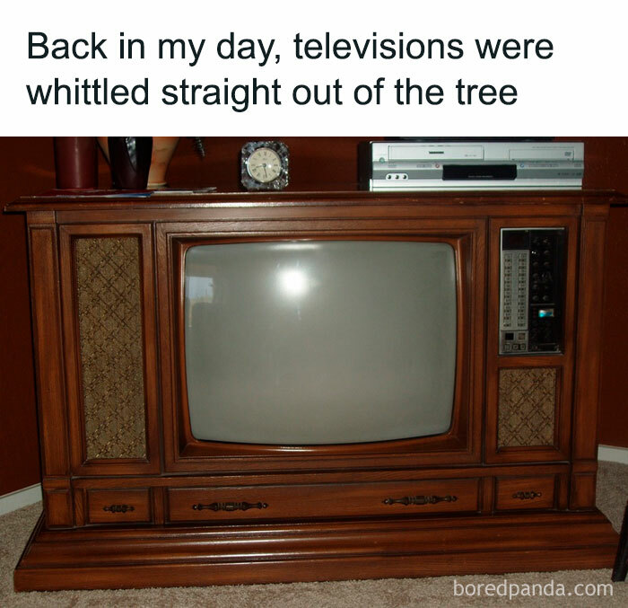 Vintage wooden console TV with retro design, highlighting humor in 'old' technology.
