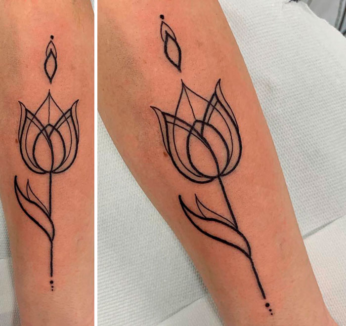 Minimalist geometric tattoo of a floral design on a forearm.