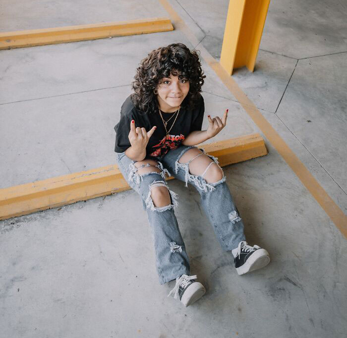 Kid Sitting On The Ground 