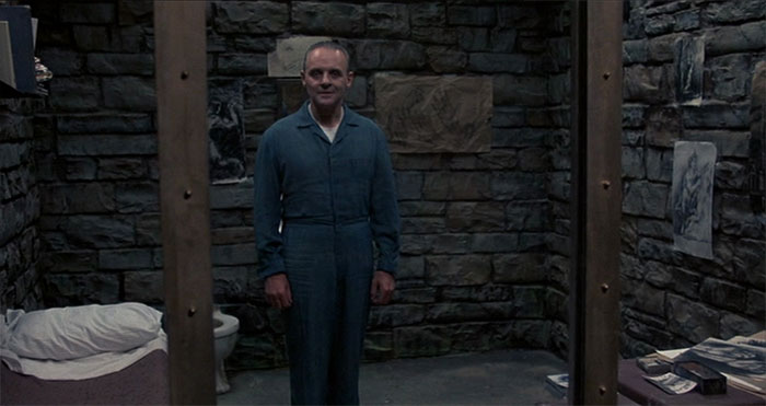 Hannibal Lecter wearing prison uniform 