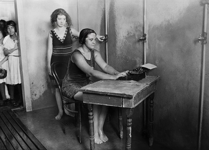 Woman Using Typewriter In The Shower