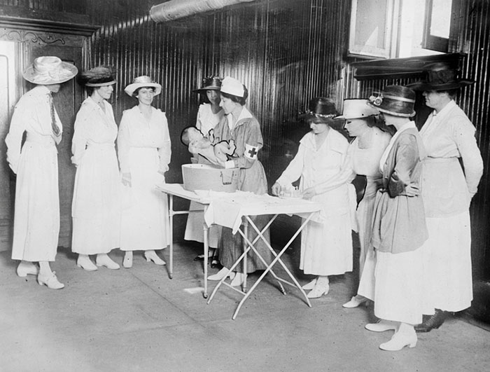 Red Cross Class In Home Hygiene And Care Of The Sick. Bathing The Baby. April 1922