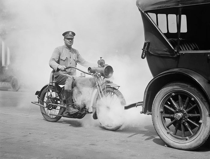 The Police On Motorcycle Trailing Car With Smoke In 1923