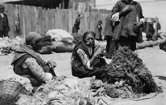 Bulgarian Peasant Women In Marketplace, With Piles Of Black And White Wool