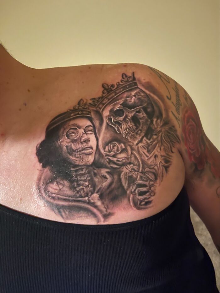 Skull and queen tattoo on shoulder with intricate details and crown.