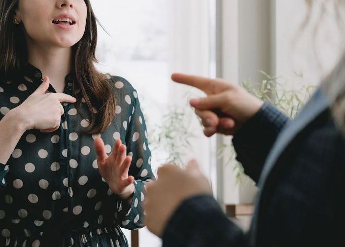 New mom in discussion about MIL wanting grandkid's footprint tattoo, in a casual setting. New mom in discussion about MIL wanting grandkid's footprint tattoo, in a casual setting.