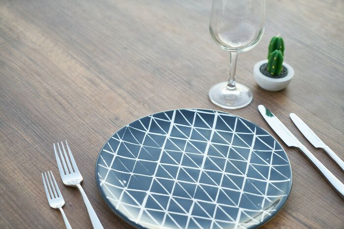 Blue plate with knifes and forks