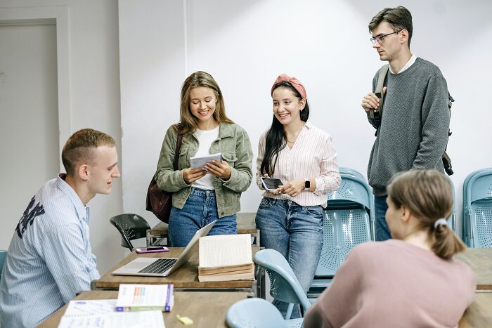 Group Of People Talking And Listening To Each Other 