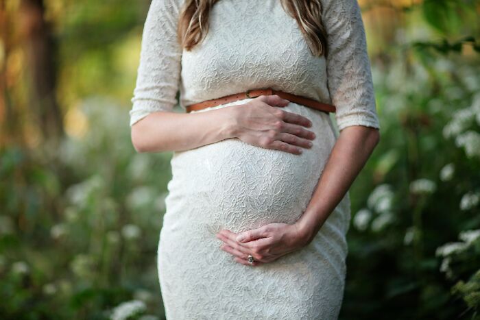 Woman Holding Her Pregnant Belly 