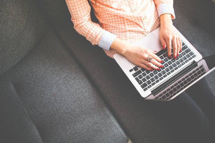 Woman Typing On Laptop 