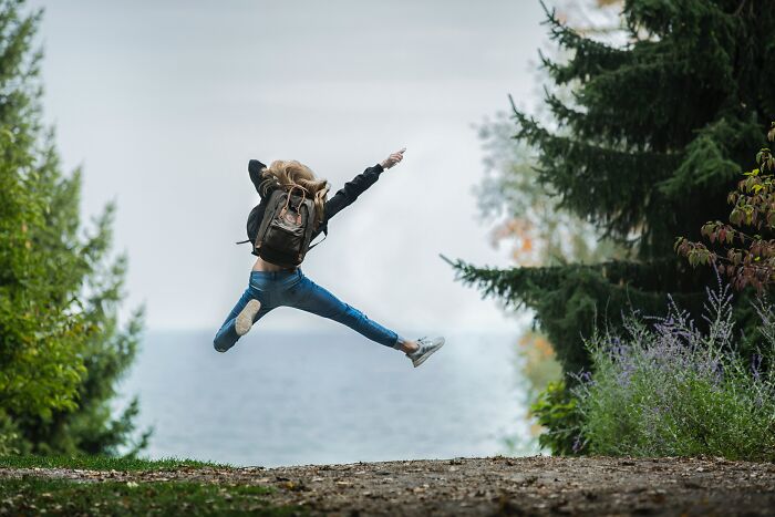 Woman Feeling Free In The Forest 
