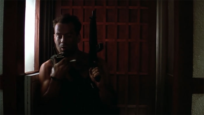 John McClane speaking on a walkie-talkie