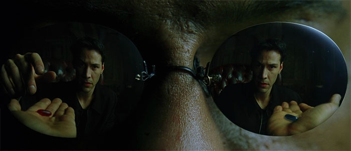 Neo's face reflection in the glasses