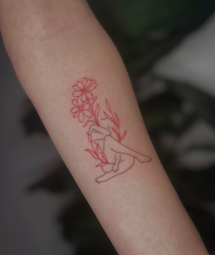 Red flower and lined body tattoo 