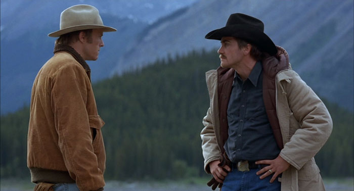 Jack and Ennis are talking surrounded by mountains