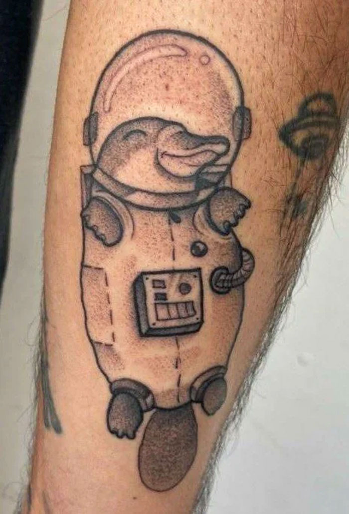 Space platypus arm tattoo