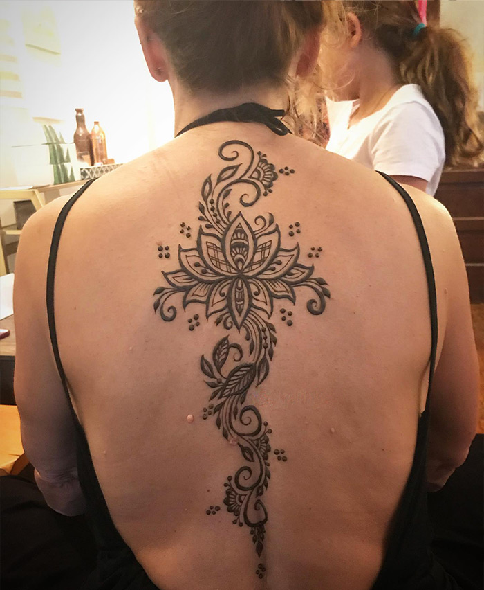 Lotus spine tattoo 