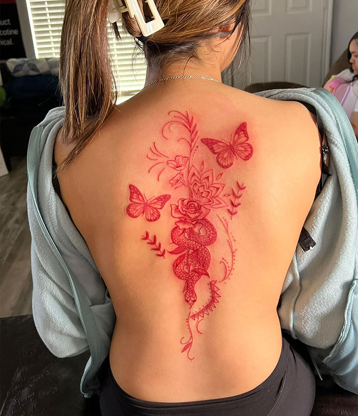 Flowers, butterflies and snake red tattoo 