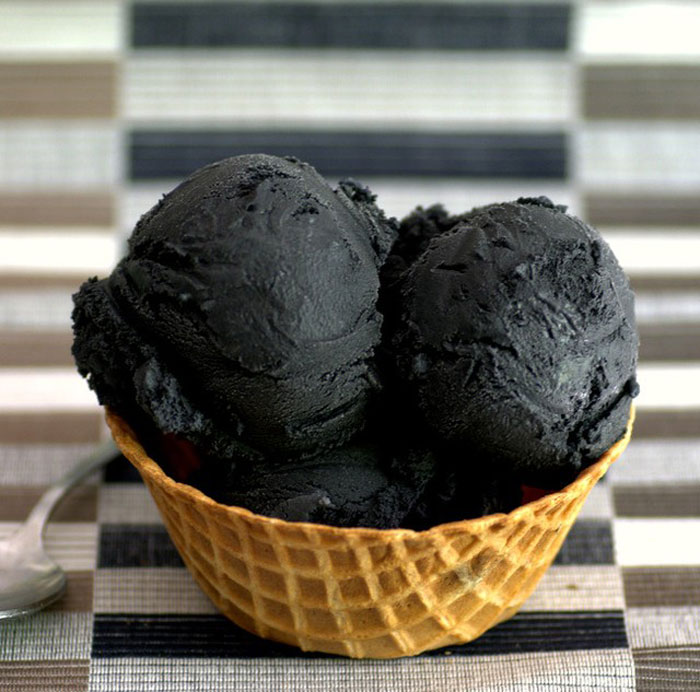 Black ice cream in the waffle cup 