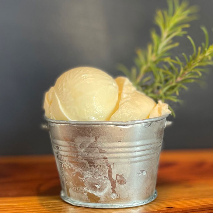 Yellow ice cream ball in the cup 