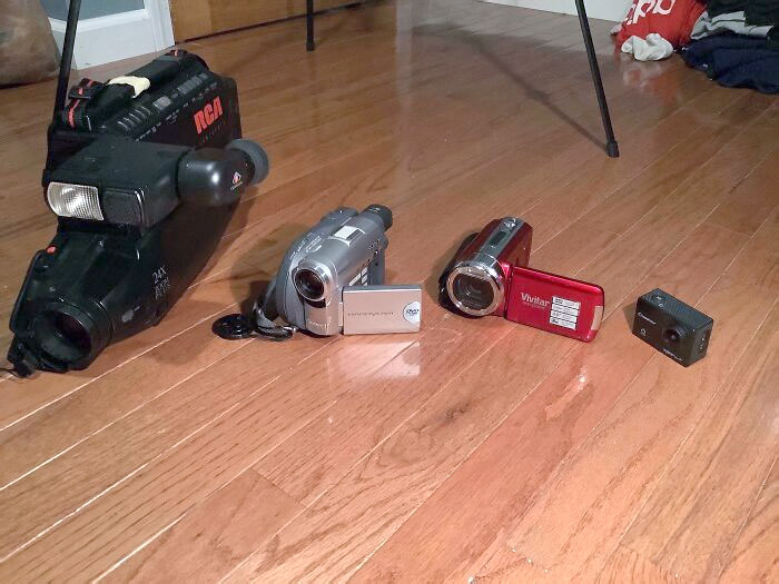 A Size Comparison Between A (Left To Right) 90s Tape Camera, 2000s Disc Camera, And 2010s And Modern Chip Cameras