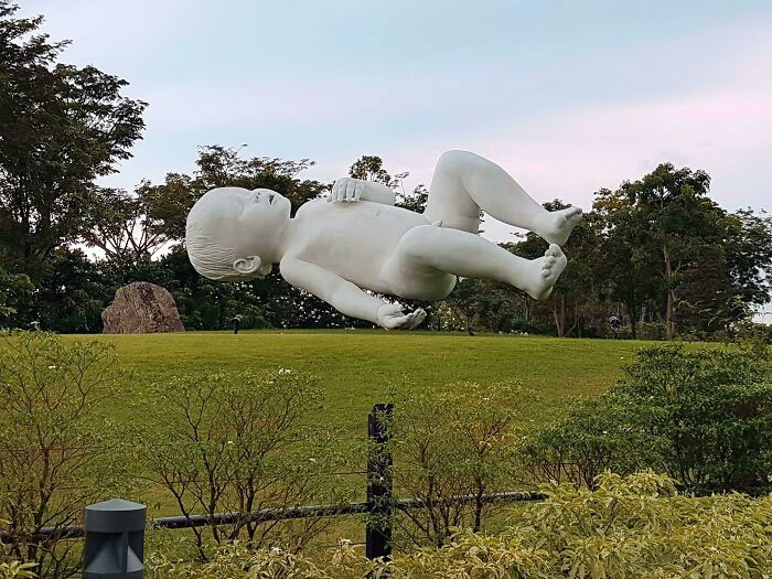 Giant Floating Baby Sculpture Titled "Planet" Is 9 Meters Long