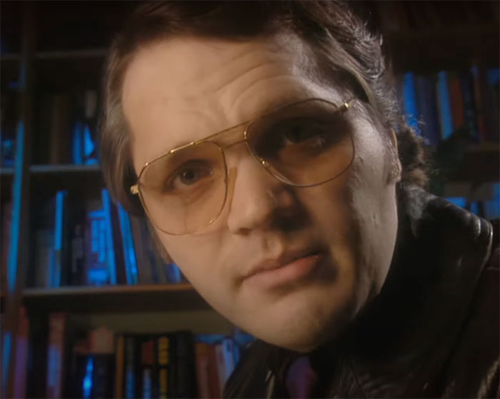 Garth wearing glasses and looking in Garth Marenghi’s Darkplace