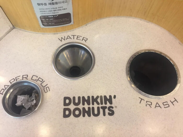 Three separate holes for recycling in Dunkin Donuts 