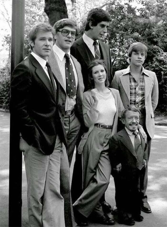 Star Wars Cast Out Of Costumes: Harrison Ford (Han Solo), David Prowse (Darth Vader), Peter Mayhew (Chewbacca), Carrie Fisher (Princess Leia), Mark Hamill (Luke Skywalker) And Kenny Baker (R2-D2). 1977