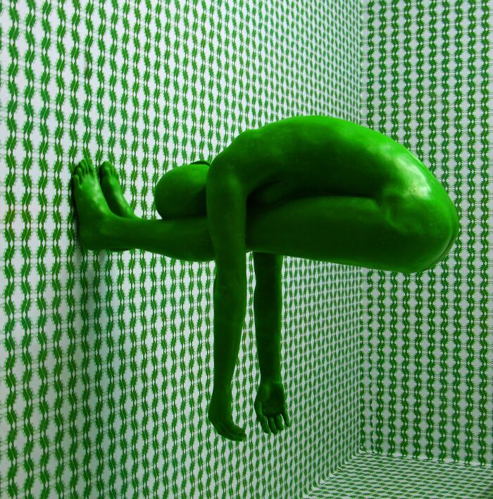 Man wearing green paint all over his body 