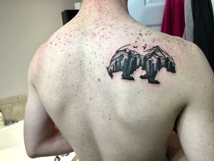 Bear and mountain back tattoo 