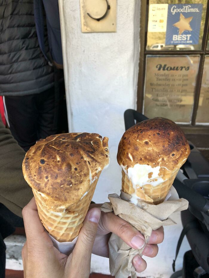 People holding marshmallow topped ice cream 