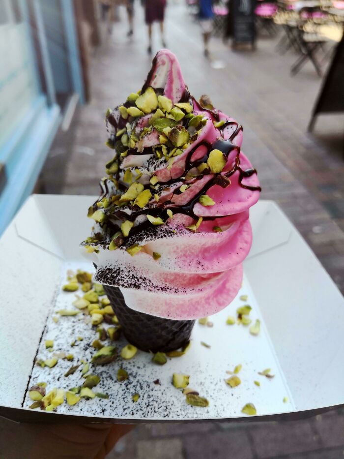 Pink, white, chocolate ice cream with pistachio 