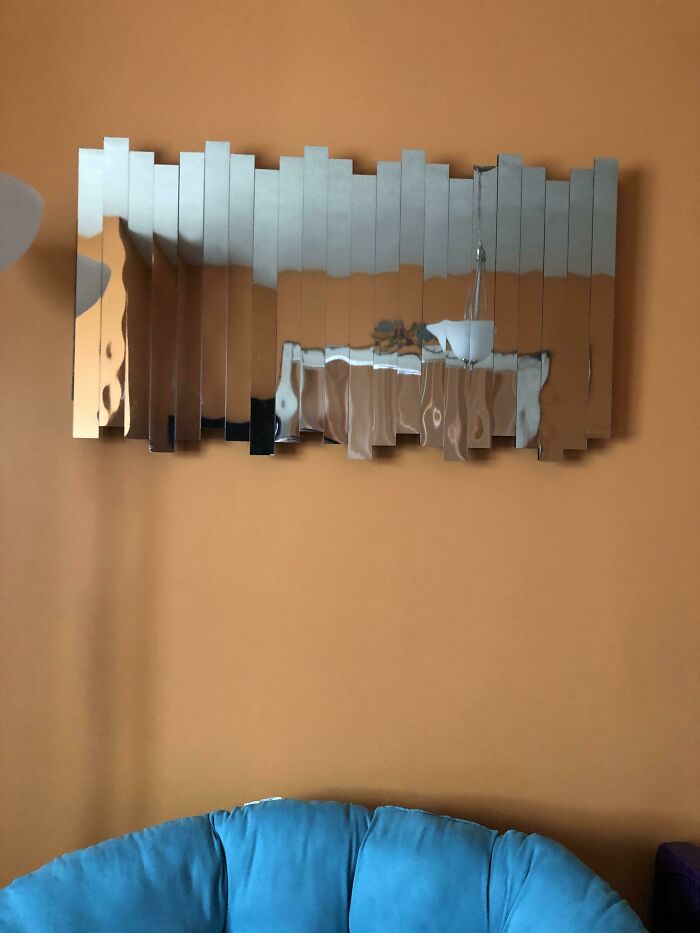 Went Dumpster Diving At Olta, Found A Huge Box Of These Reflective Mirror Strips (Parts From A Makeup Display They Didn’t End Up Using?). Took The Back Of An Old Canvas, Some Hot Glue, A Dash Of Tedious Arranging, And Presto! An Accent Wall Mirror.. Thingy!