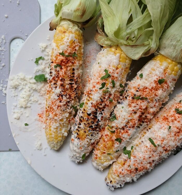 corn on the cob with spices and cheese